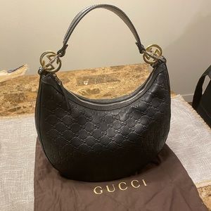 Gucci purse - black leather with gold accents